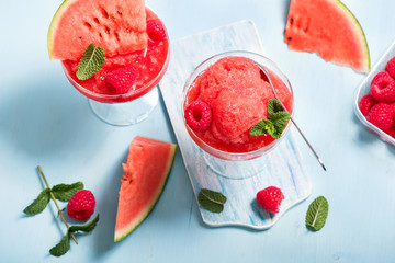 Wall Mural - Watermelon sorbet or granita, refreshing summer dessert with strawberries