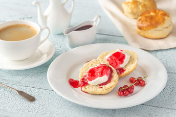 Canvas Print - Classic scones with cream and berry jam