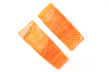 Wall Mural - Two slices of salmon, shot from the top on a white background with a place for text