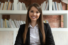 Smiling Young Businesswoman Teacher Looking At Camera At Job Interview