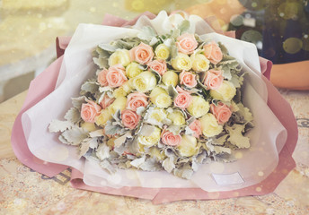 Wall Mural - roses bouquet with glowing light background