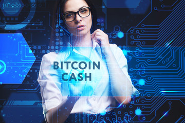 The concept of business, technology, the Internet and the network. A young entrepreneur working on a virtual screen of the future and sees the inscription: Bitcoin cash