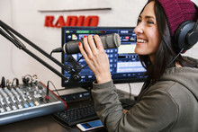 Cheerful Young Woman Radio Host Broadcasting