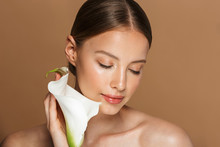 Image Of Calm Half-naked Woman Holding White Flower With Closed Eyes