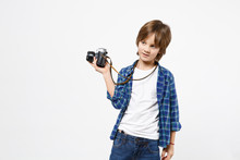 Fun Little Kid Boy In Blue T-shirt Hold Retro Vintage Photo Camera, Doing Photo Shot Isolated On White Wall Background Children Studio Portrait. People Childhood Lifestyle Concept. Mock Up Copy Space.