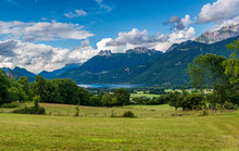 Landscape In Southern France With Lake And Rocky Mountains Around.