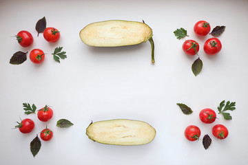 Wall Mural - Eggplant in the cut and cherry tomatoes, ornament. View from above