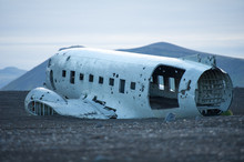 The Abandoned DC-3 Airplane On Solheimasandur Beach. Airplane Wreckage On Black Sand Beach. Douglas Dakota DC3, US Navy, South Iceland.