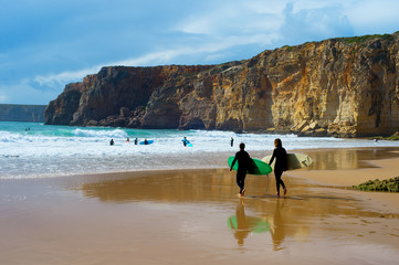 Wall Mural - Surfers surfboards beach Portugal cliff