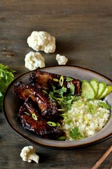 Wall Mural - short ribs Asian with cauliflower rice. keto diet recipe. low carbohydrate meal