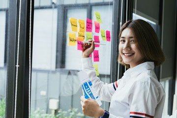 young asian female creative mobile application developer working with mobile template design screen 