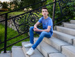 © Elena Odareeva - Teenage boy on stairs on the street