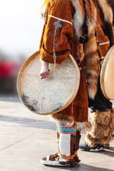 The folk ensemble performance in dress of indigenous people and tambourine of Kamchatka.