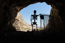 Skeleton Silhouette In The Mouth Of A Gated Mine Stay Out Stay Alive