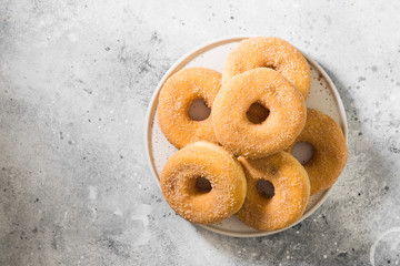 Doughnuts with sugar sprinkles. Light grey background