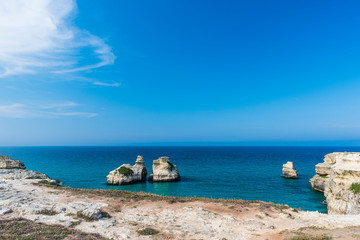 dreamlike salento. bay of torre dell'orso and stacks of the two sisters. puglia, italy