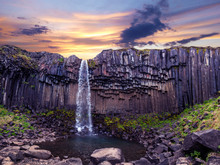 Magical Landscape With A Famous Svartifoss Waterfall In The Middle Of Basalt Pillars In Skaftafell, Vatnajokull National Park, Iceland. Exotic Countries. Amazing Places. Popular Tourist Atraction.