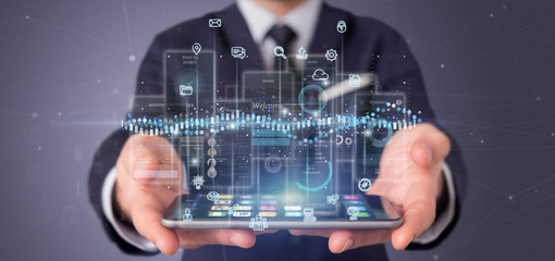 Wall Mural - businessman holding user interface screens with icon, stats and data 3d rendering