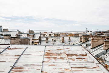 Wall Mural - Beautiful top view of the roofs of authentic houses in St. Petersburg in Russia.