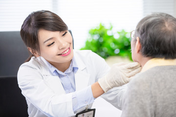 Female doctor check throat