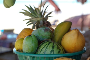 Wall Mural - Yellow coconuts are sold on the market in Asia. Sale of vegetarian fruits outdoors. Stock photo