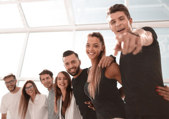 Wall Mural - happy business team standing in bright office.