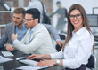 © ASDF - business woman sitting at the office Desk