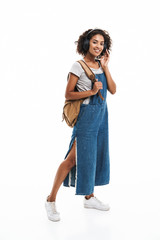 Poster - Image of positive african american woman smiling and listening to music with headphones