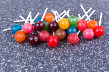 Wall Mural - Pile of multicolored candy suckers