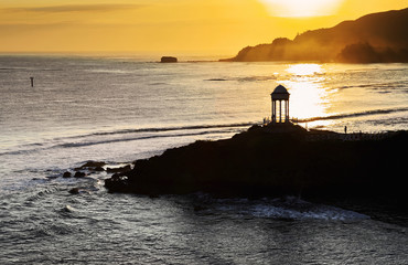 Wall Mural - Silhouette of Gazebo on a Sea Shore at sunrise