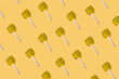 Yellow candy sweet pattern on the yellow minimal background.Candy flatlay top view
