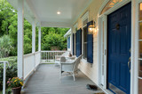 Fototapeta Sawanna - Beautiful front entrance of Southern home with covered porch.