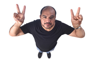 Wall Mural - Latin american man making the victory sign on a white background