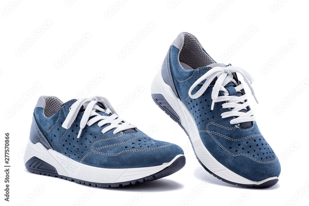 Close up of elegant light blue sports shoes in natural nubuck leather for adult men photographed on a white background. Fashion accessories. - obrazy, fototapety, plakaty 