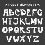 Fototapeta Młodzieżowe - Funny white cut alphabet for your banners or invitations. Set of handdrawn letters made in vector isolated on black background. Abc - perfect illustration for your design - print, poster, card, logo