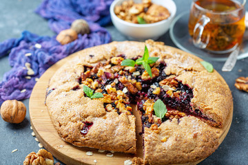 Wall Mural - Cut Galette pie with black currant.