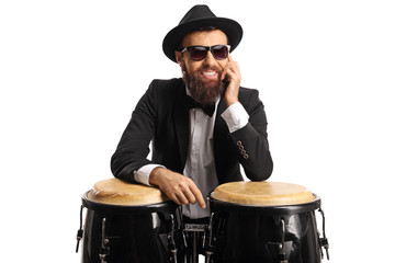 Wall Mural - Male musician posing on conga drums