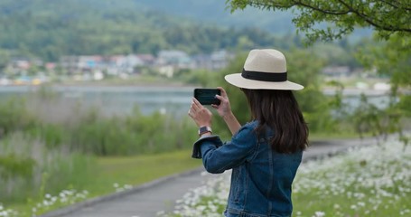 Sticker - Woman take photo with cellphone in countryside