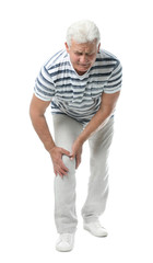 Poster - Full length portrait of senior man having knee problems on white background