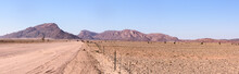 Gravel Dirt Road Leading Towards Mountains In Central Namibia