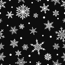 Christmas Seamless Pattern Of Complex Big And Small Snowflakes In White Colors On Black Background
