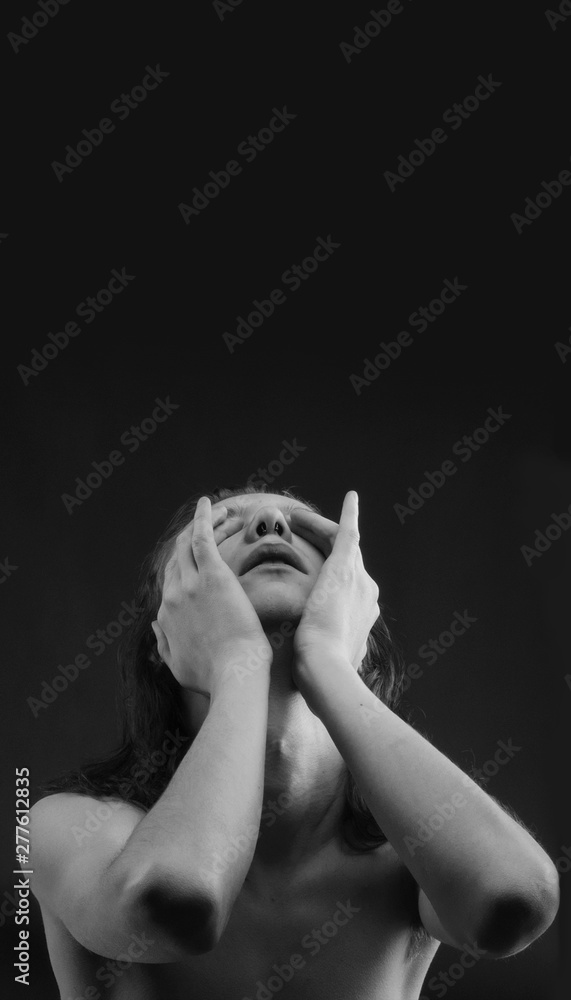 Black and white photo of a suffering teenager covering his eyes with ...