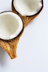 Ripe coconuts on white. Top view of tropical fruit.