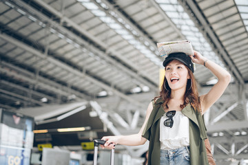 Wall Mural - Asian women tourists delighted when she met fellow travelers in the airport