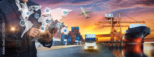 Cuadros en Lienzo Multiple exposures of Businessman touching tablet for analyze stock at logistics