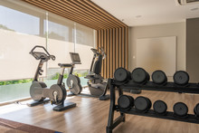Luxury Interior Fitness Machine And Dumbbells In Gym Club