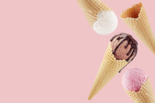 Decorative Border Of Fly Different Flavor Ice Cream Cones In Waffle - White, Pink, Brown With Chocolate Sauce On Pink.