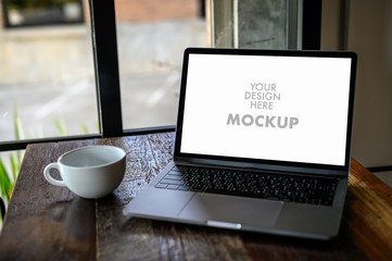 Mockup of business man using laptop screen for your advertising text message Laptop with blank screen on table compute work