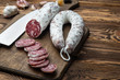 French salami on cutting board on wooden table