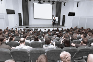 audience listens to the report at the business conference